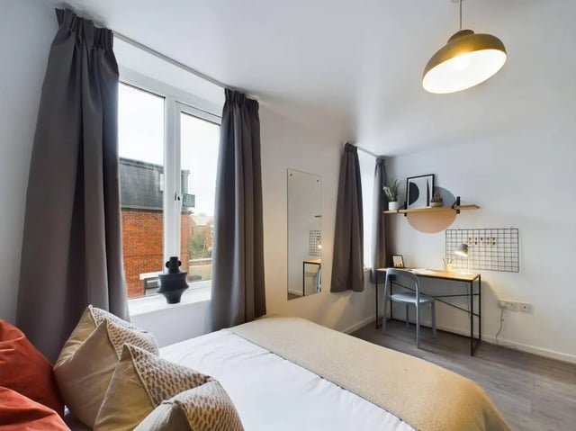 Bed desk mirror and shelving unit bedroom at 7 Bedroom House at 5, CYRIL STREET in Manchester Student Accommodation
