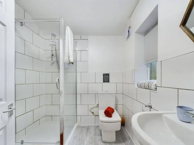 Shower toilet sink with tiled walls bathroom at 7 Bedroom House at 5, CYRIL STREET in Manchester Student Accommodation