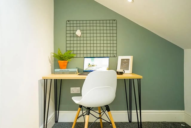Desk with laptop plant frame and chair Study area at 5 Bedroom House at 19, Driffield Street in Manchester Student Accommodation