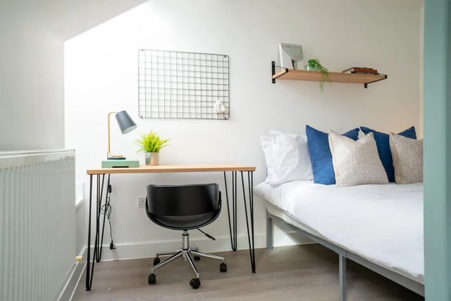 Desk lamp plant grid shelf bed pillows bedroom at 3 Bedroom House at Flat 1, 7, EILEEN GROVE in Manchester Student Accommodation