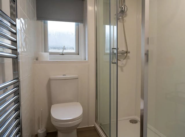 Toilet shower and towel rail Bathroom at 8 Bedroom House at 4, Ossory Street in Manchester Student Accommodation