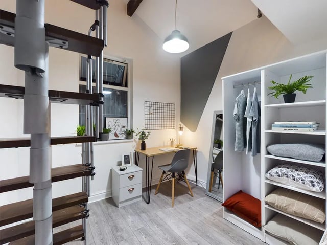 Desk and closet with spiral stairs bedroom at 7 Bedroom House at 39, Ossory Street in Manchester Student Accommodation