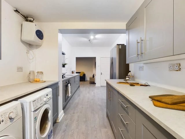 Washer dryer grey cabinets countertops kitchen at 7 Bedroom House at 39, Ossory Street in Manchester Student Accommodation