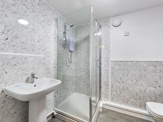 Sink shower enclosure toilet and tiled walls bathroom at 7 Bedroom House at 39, Ossory Street in Manchester Student Accommodation