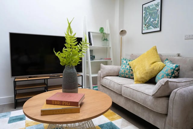 Sofa TV and coffee table living room at 3 Bedroom House at Flat 1, 34, RUSKIN AVENUE in Manchester Student Accommodation