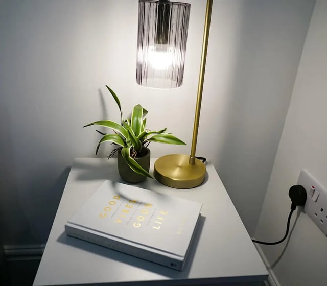 Book plant lamp and outlet bedside table image at 6 Bedroom House at 49, Ruskin Avenue in Manchester Student Accommodation