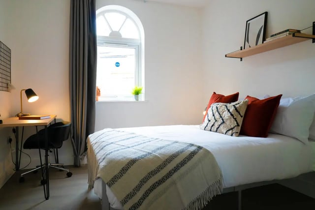 Bed desk lamp chair and pillows bedroom at 3 Bedroom House at 68, St. Bees Close in Manchester Student Accommodation