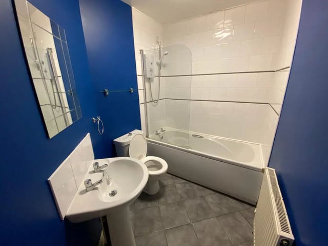 Sink toilet bathtub mirror tiled bathroom exterior at 4 Bedroom House at 16, Lovat Road in Preston Student Accommodation