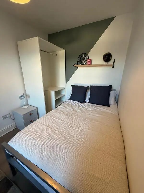Bed wardrobe bedside table decor bedroom at 6 Bedroom House at 59, Trafford Street in Preston Student Accommodation