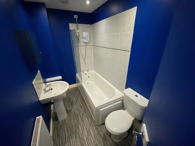 Toilet sink bathtub with shower screen bathroom at 6 Bedroom House at 59, Trafford Street in Preston Student Accommodation