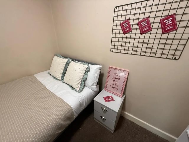 Bed with pillows and bedside cabinet bedroom at 8 Bedroom House at 73, Dallas Street in Preston Student Accommodation