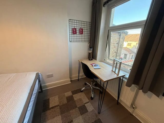 Bed desk lamp chair and rug study area at 8 Bedroom House at 73, Dallas Street in Preston Student Accommodation