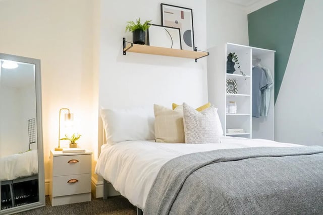 Bed with pillows bedside table and closet bedroom at 4 Bedroom House at 24, Studios at, West Parade in Lincoln Student Accommodation