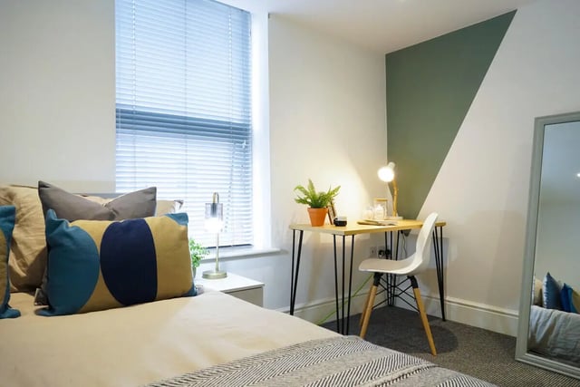 Bed desk chair plant mirror bedroom at 4 Bedroom House at 24, Studios at, West Parade in Lincoln Student Accommodation