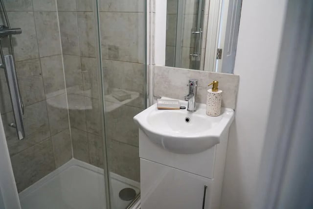 Shower sink soap dispenser and cabinet bathroom at 7 Bedroom House at 146, West Parade in Lincoln Student Accommodation