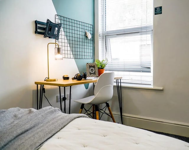 Desk lamp headphones framed picture plant study area at 7 Bedroom House at 146, West Parade in Lincoln Student Accommodation
