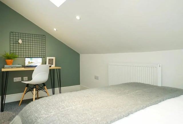 Desk chair laptop plant bookshelf bedroom area at 7 Bedroom House at 146, West Parade in Lincoln Student Accommodation