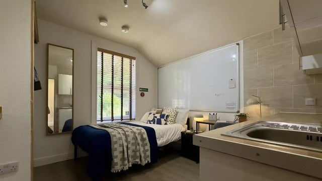 Bed whiteboard mirror sink kitchen studio at 6 Bedroom House at 12, Studios at, Richmond Road in Lincoln Student Accommodation