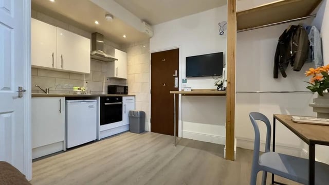 Studio kitchen with fridge oven and hanging coats kitchen at 6 Bedroom House at 12, Studios at, Richmond Road in Lincoln Student Accommodation