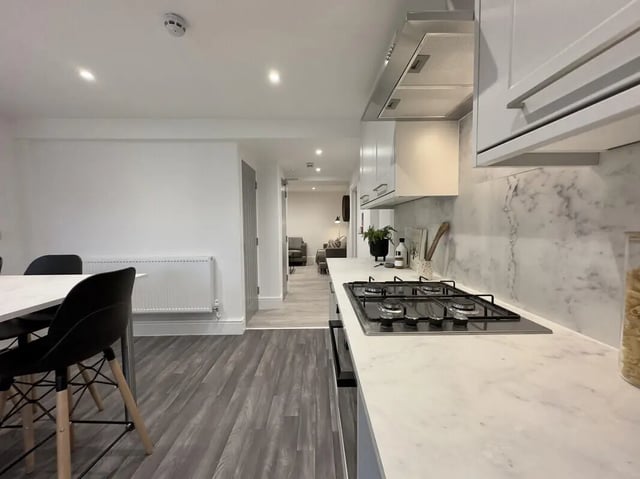 Modern kitchen with dining area living room view kitchen at 6 Bedroom House at 45, Monks Road in Lincoln Student Accommodation