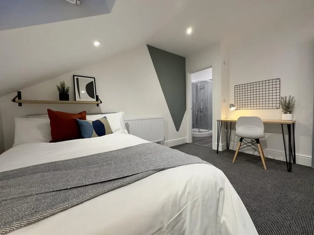 Bed desk shower room and radiator bedroom at 6 Bedroom House at 45, Monks Road in Lincoln Student Accommodation