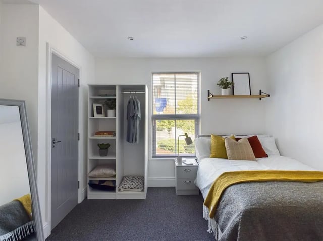 Closet bed nightstand lamp bedroom at 6 Bedroom House at 47, Monks Road in Lincoln Student Accommodation