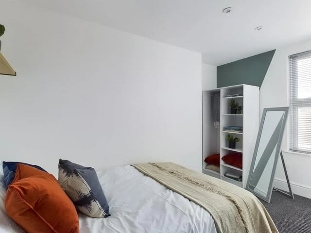 Bed wardrobe mirror bedroom at 6 Bedroom House at 47, Monks Road in Lincoln Student Accommodation
