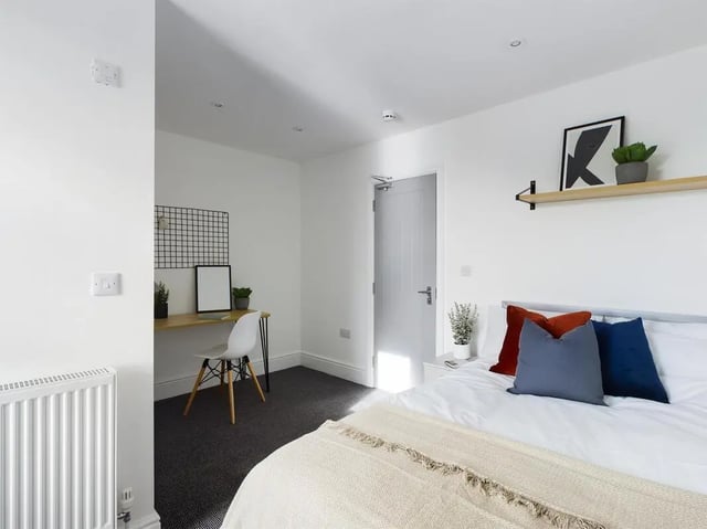 Bed desk and chair white bedroom at 6 Bedroom House at 47, Monks Road in Lincoln Student Accommodation