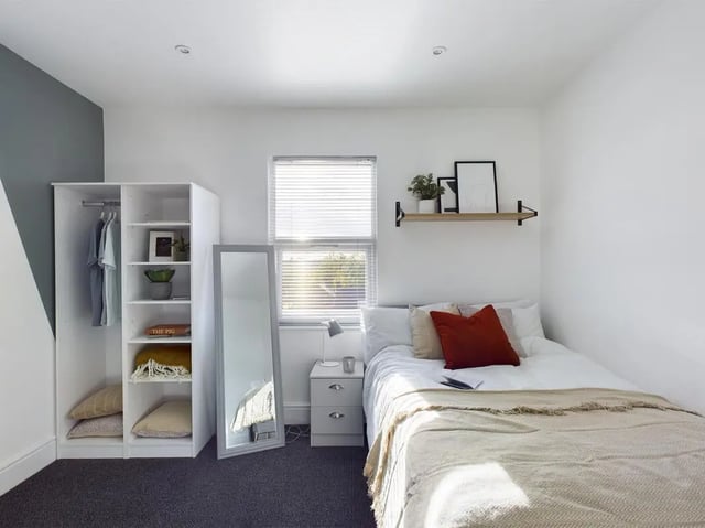 Wardrobe bed mirror nightstand and shelf bedroom at 6 Bedroom House at 47, Monks Road in Lincoln Student Accommodation