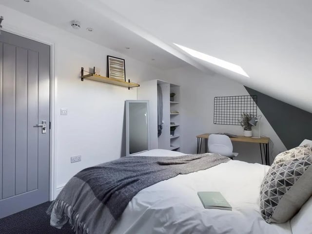 Bed desk wardrobe mirror and door bedroom at 6 Bedroom House at 47, Monks Road in Lincoln Student Accommodation