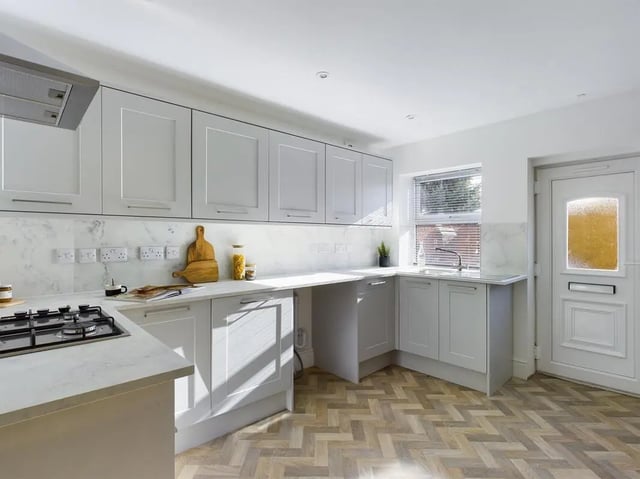 Modern grey cabinets hob sink and door kitchen at 6 Bedroom House at 47, Monks Road in Lincoln Student Accommodation
