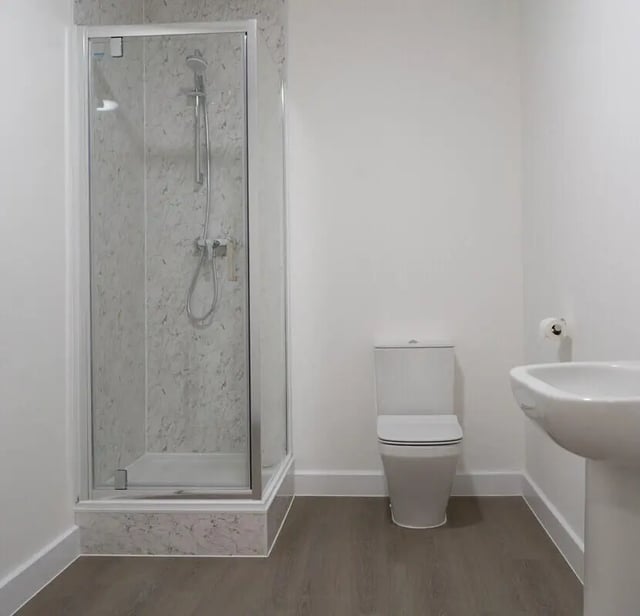 Shower toilet sink white bathroom at 8 Bedroom House at 71, Monks Road in Lincoln Student Accommodation