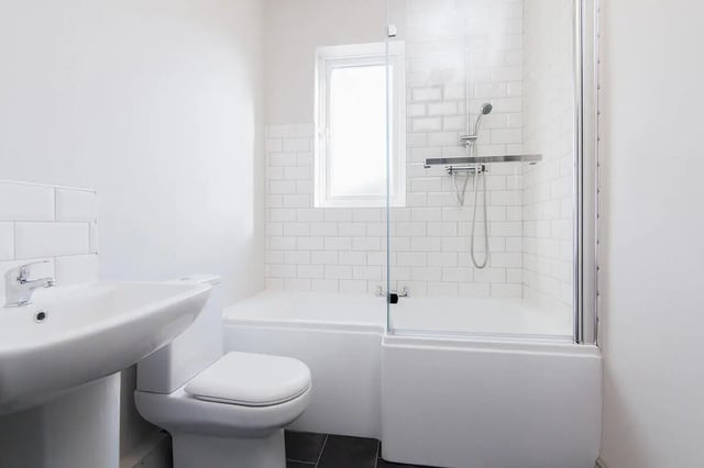 Sink toilet bathtub shower with window bathroom at 3 Bedroom House at 8, Haddon Street in Salford Student Accommodation