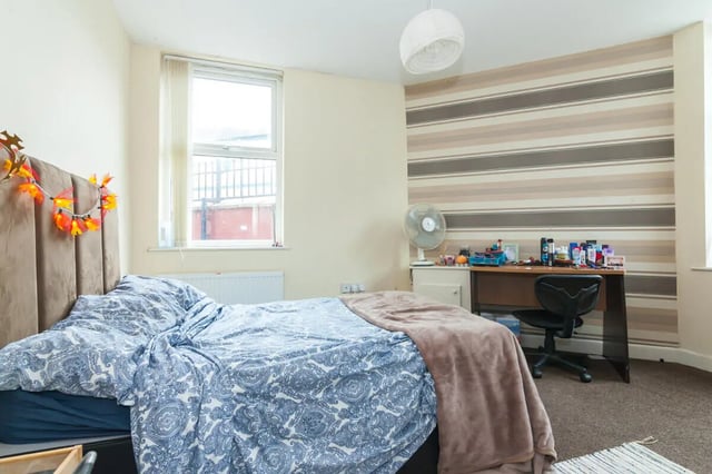 Bed desk chair fan and wallpaper bedroom at 5 Bedroom House at 11, Mildred Street in Salford Student Accommodation