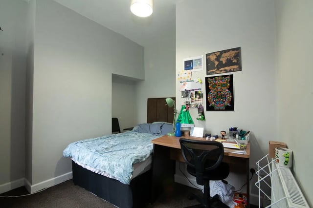 Bed desk chair and radiator student bedroom at 5 Bedroom House at 11, Mildred Street in Salford Student Accommodation