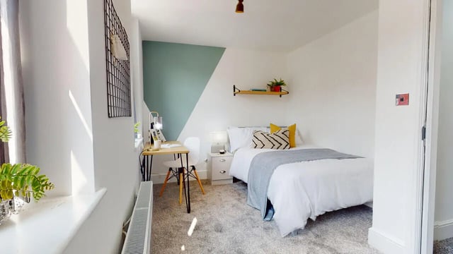 Bed desk chair lamp rug and bedside table bedroom at 6 Bedroom House at 18, Halsbury Road in Liverpool Student Accommodation