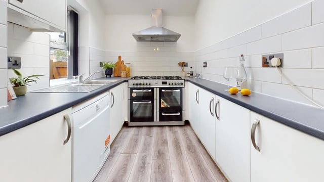 Range oven sink and dishwasher kitchen at 6 Bedroom House at 18, Halsbury Road in Liverpool Student Accommodation