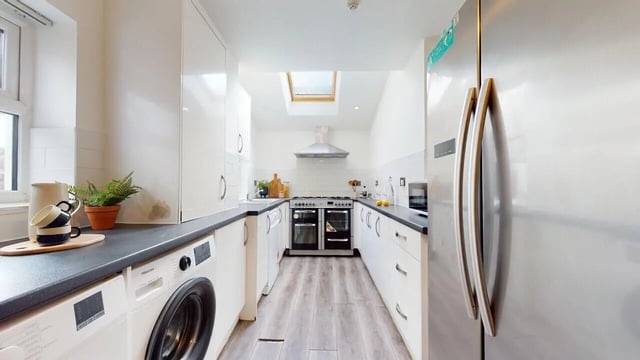 Modern kitchen with appliances dishwasher fridge and oven kitchen at 6 Bedroom House at 18, Halsbury Road in Liverpool Student Accommodation