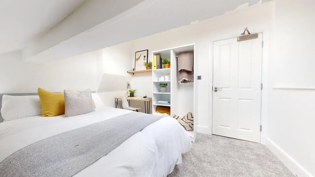 Bed study area closet and door bedroom at 6 Bedroom House at 18, Halsbury Road in Liverpool Student Accommodation