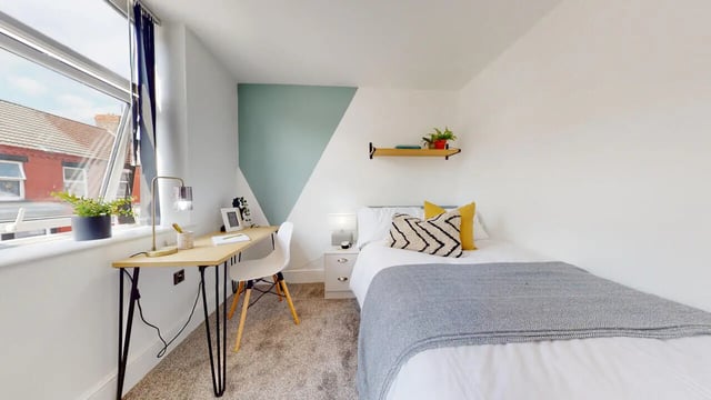 Desk bed and shelving unit bedroom at 6 Bedroom House at 18, Halsbury Road in Liverpool Student Accommodation