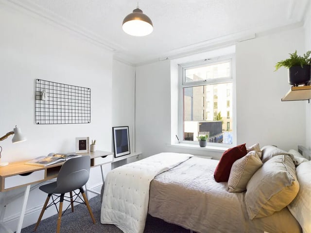 Desk chair bed lamp grid artwork bedroom at 6 Bedroom House at 75A, West Parade in Lincoln Student Accommodation