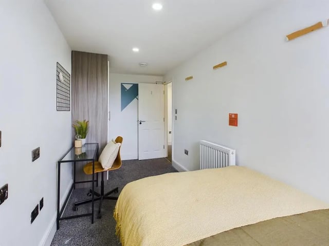 Wardrobe desk chair plant bed radiator bedroom at 4 Bedroom House at Flat 5, 265, Edge Lane in Liverpool Student Accommodation