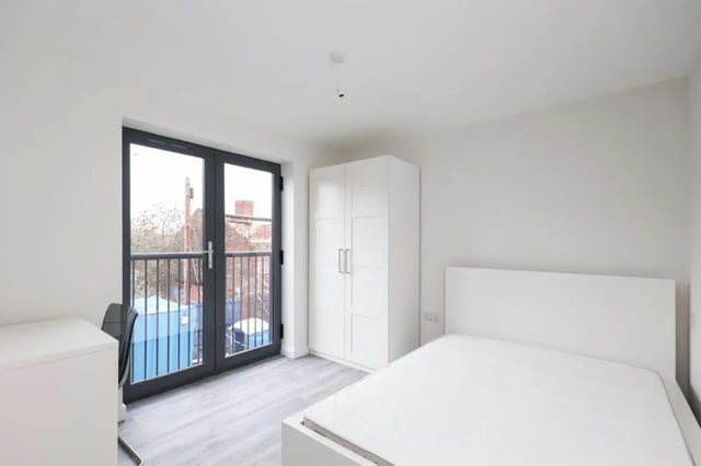 Bed desk wardrobe and balcony bedroom at 7 Bedroom House at 4, Well Meadow Drive in Sheffield Student Accommodation