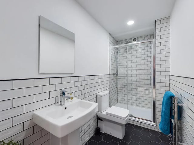 Sink toilet and glass shower enclosure bathroom at 7 Bedroom House at 4, Well Meadow Drive in Sheffield Student Accommodation