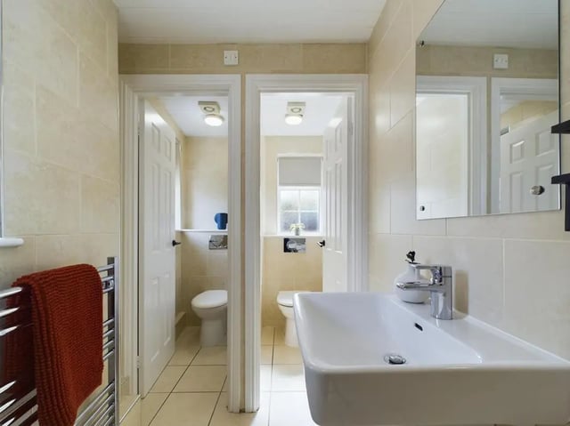 Sink towel rack two toilets bathroom at 9 Bedroom House at 19A, Bower Road in Sheffield Student Accommodation