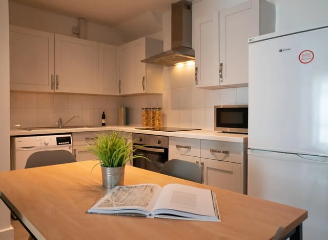 Kitchen with dining table open book and plant kitchen at 4 Bedroom House at 19B, Bower Road in Sheffield Student Accommodation