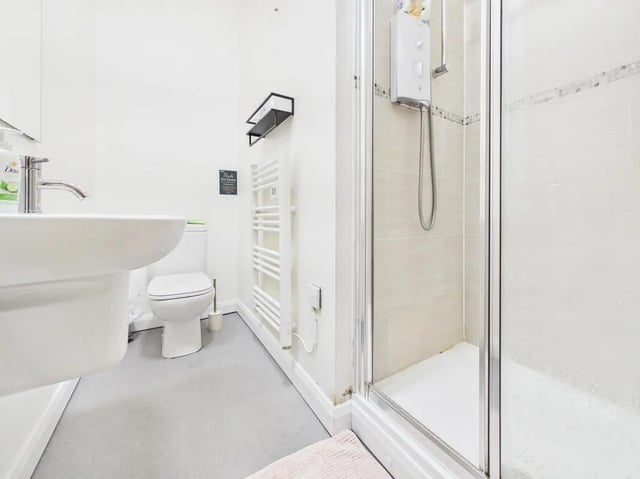 Sink toilet heated towel rail shower stall bathroom at 3 Bedroom House at Flat 3, 18, China Street in Lancaster Student Accommodation