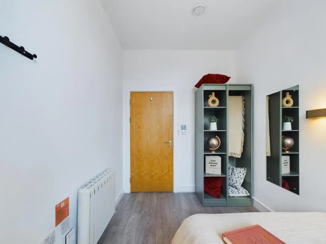 Wooden door shelving unit with globe and mirror bedroom at 5 Bedroom House at Flat 4, 18, China Street in Lancaster Student Accommodation
