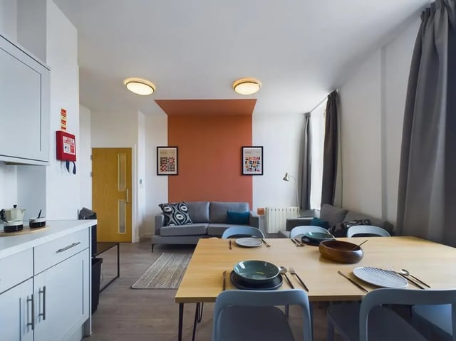 Dining area with table chairs and kitchen living area at 5 Bedroom House at Flat 4, 18, China Street in Lancaster Student Accommodation