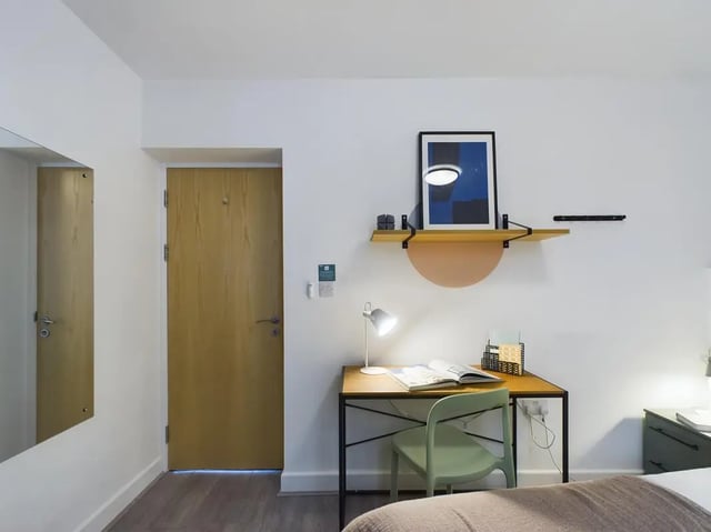 Desk chair lamp and art study area at 5 Bedroom House at Flat 4, 18, China Street in Lancaster Student Accommodation
